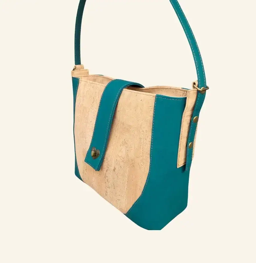 Schoudertas naturel met teal zijaanzicht